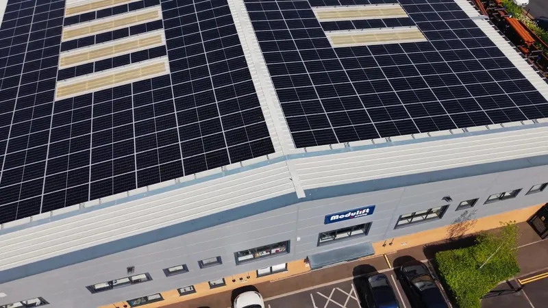 Aerial view of the Modulift building with its roof covered in solar panels