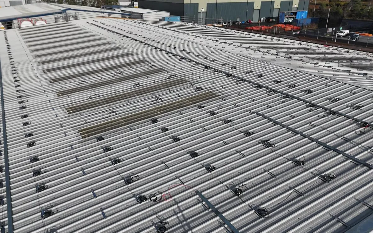 Drone view of a commercial roof at Modulift with the mounting rails going on