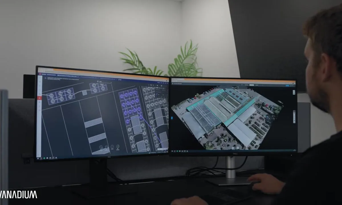 Vanadium designer with the 3D site model and the electrical stringing drawing on two screens, the drawings behind a G99 application