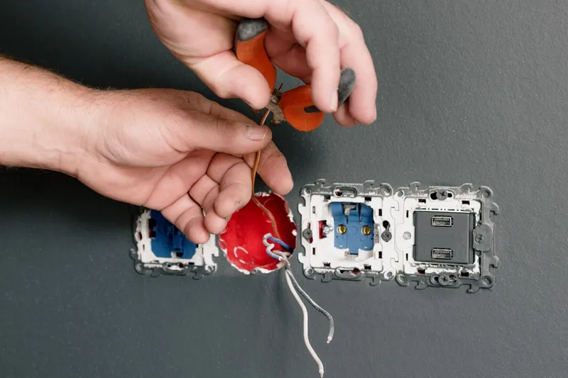Fitting a new double socket into a grey wall
