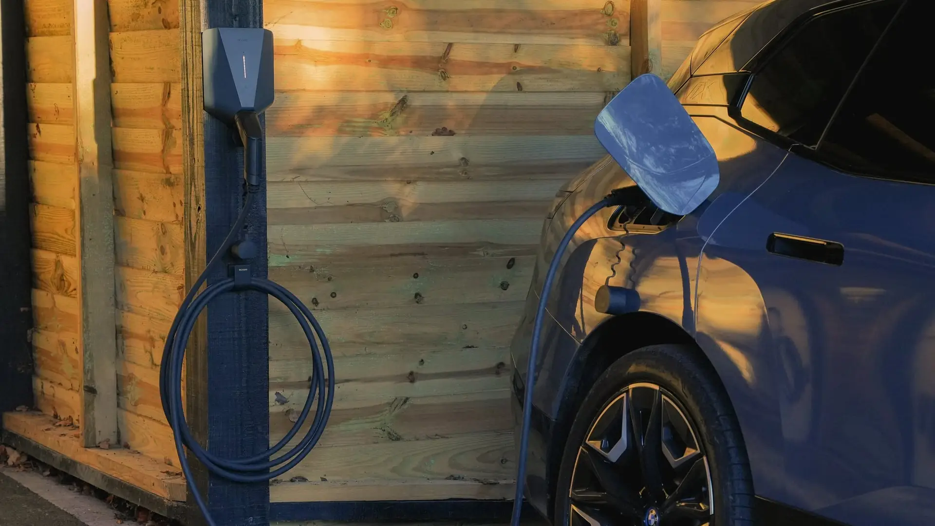 Easee home EV charger installed beside a garage door