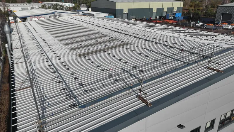 SolarEdge inverters mounted on the wall inside the factory