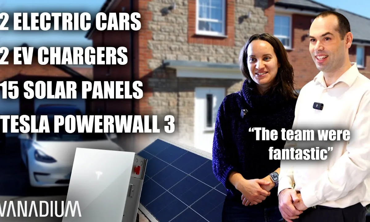 Aerial view of a house in Wimborne with solar panels on the roof and an electric car in the driveway.