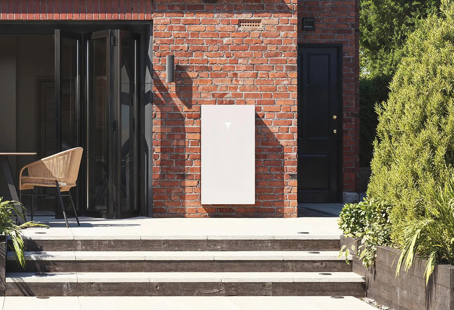 Tesla Powerwall 3 on the wall of a detached house