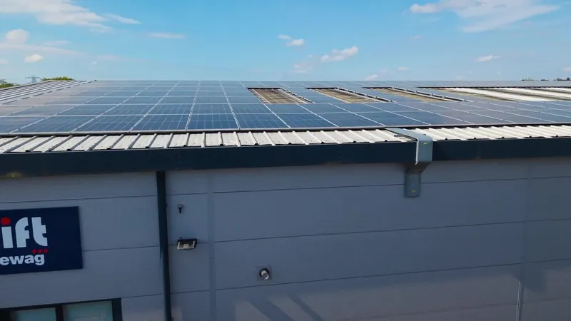 Closer drone view across the finished panel rows