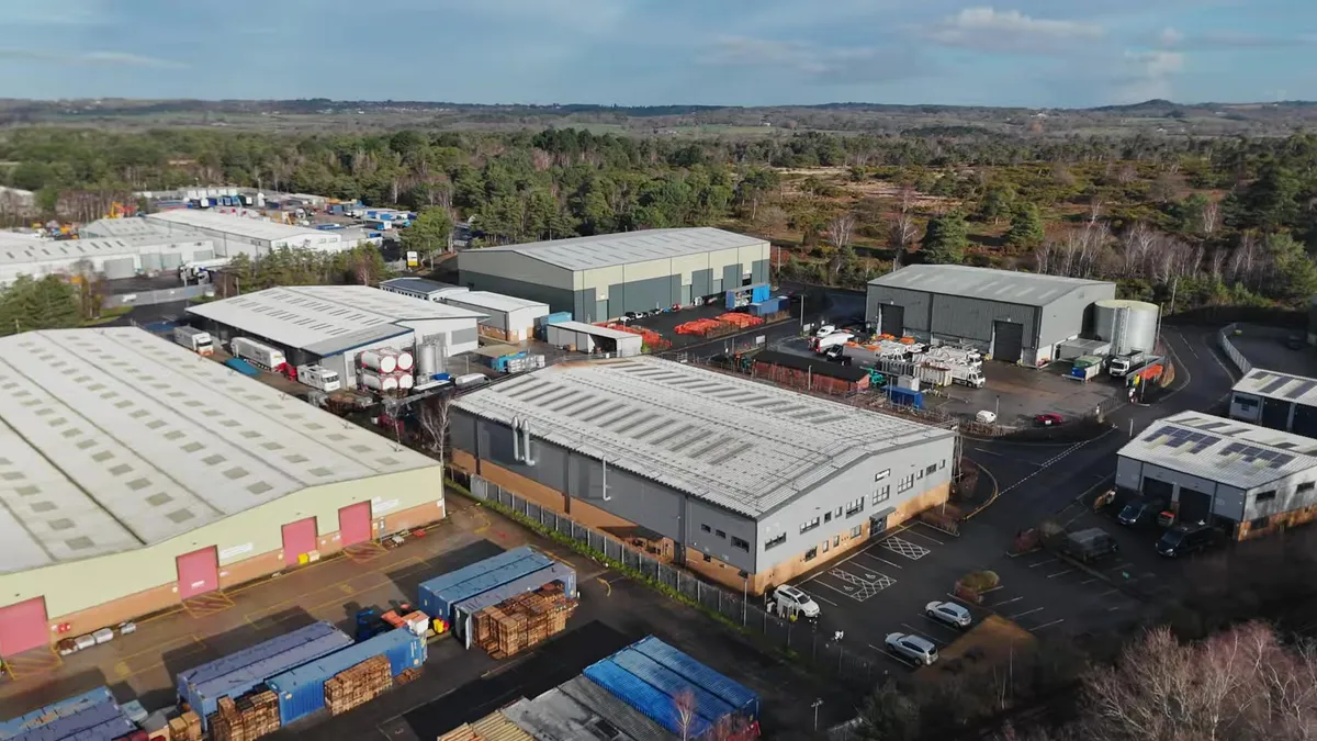 Drone's eye view of Modulift's industrial complex with multiple large buildings.