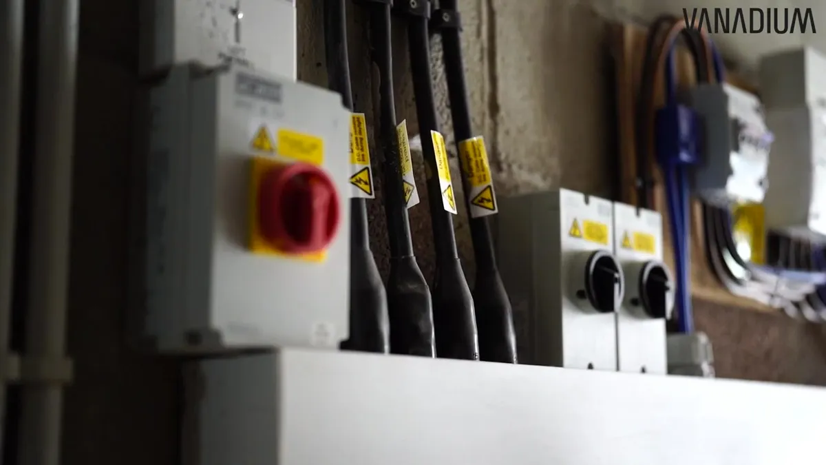Electrical wiring and switches in a utility room, part of the energy system.