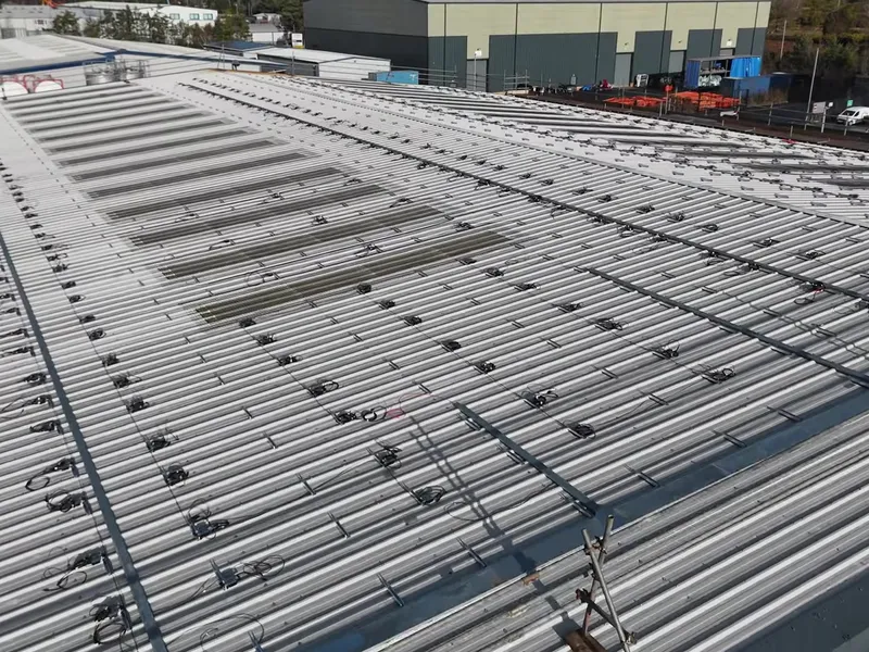 Close-up aerial view of Modulift's roof with solar panel mounting rails installed.