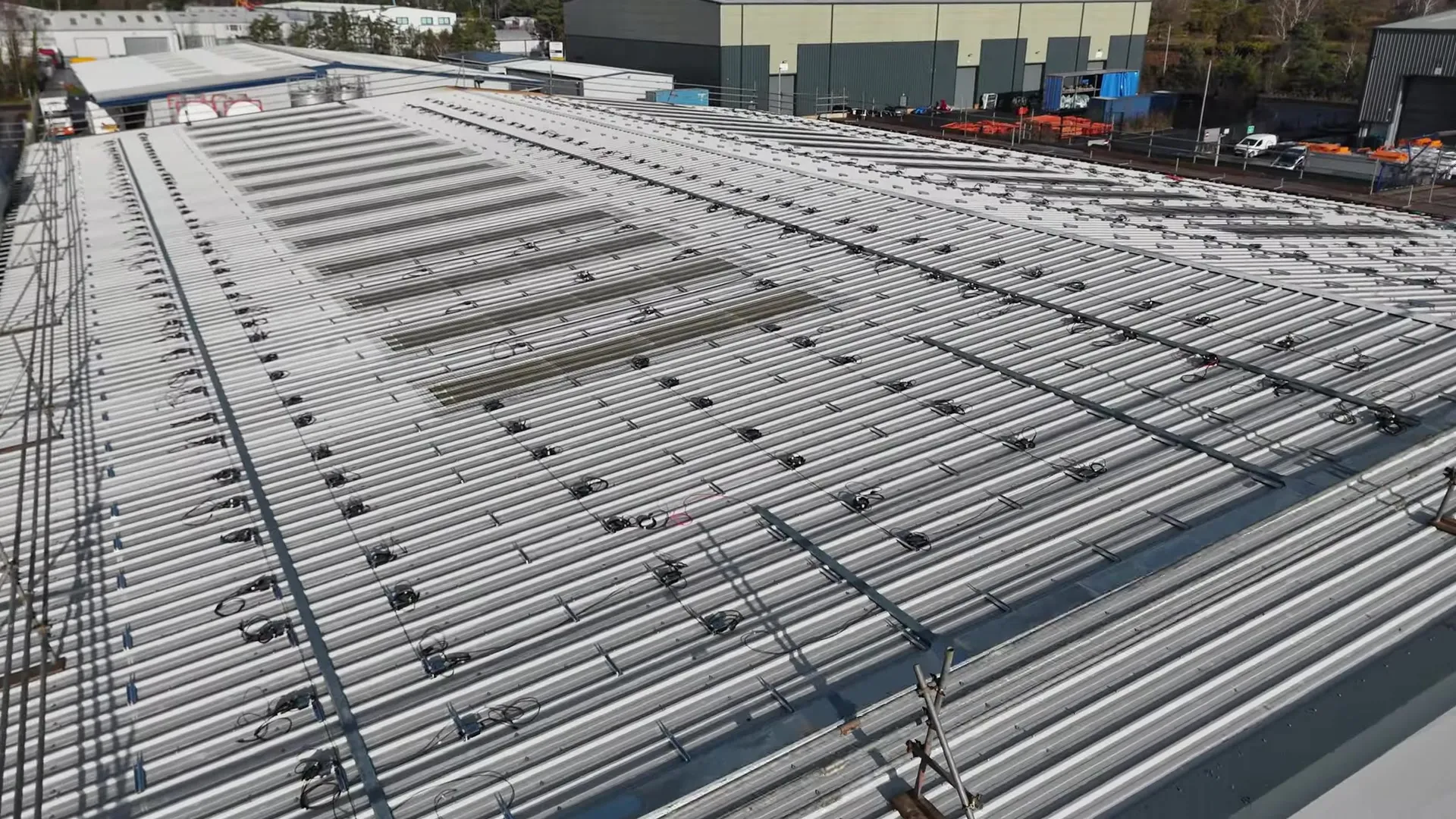 Close-up aerial view of Modulift's roof with solar panel mounting rails installed.