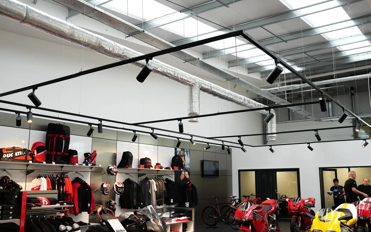 Track lighting over the retail area of the Ducati showroom